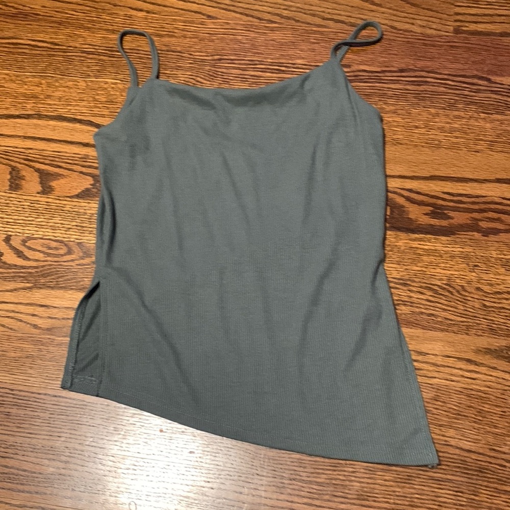 Long sage green tank top with cut outs on the sides